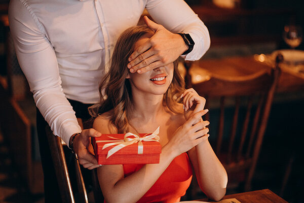 A thoughtful gift shared between an adult couple during a date