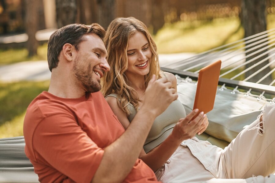 An adult couple sharing a relaxed moment outdoors