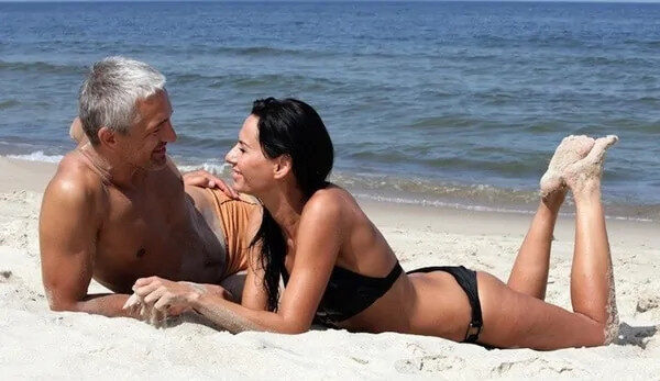 An adult couple spending relaxed time together on an American beach